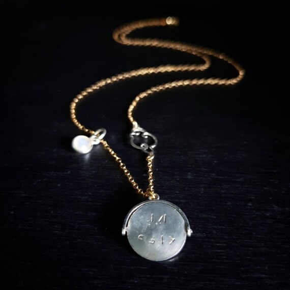 Kiss Me Quick Spinning Coin Pendant